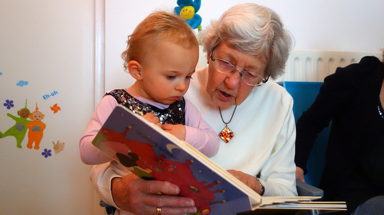 grandmother reading to grandchild