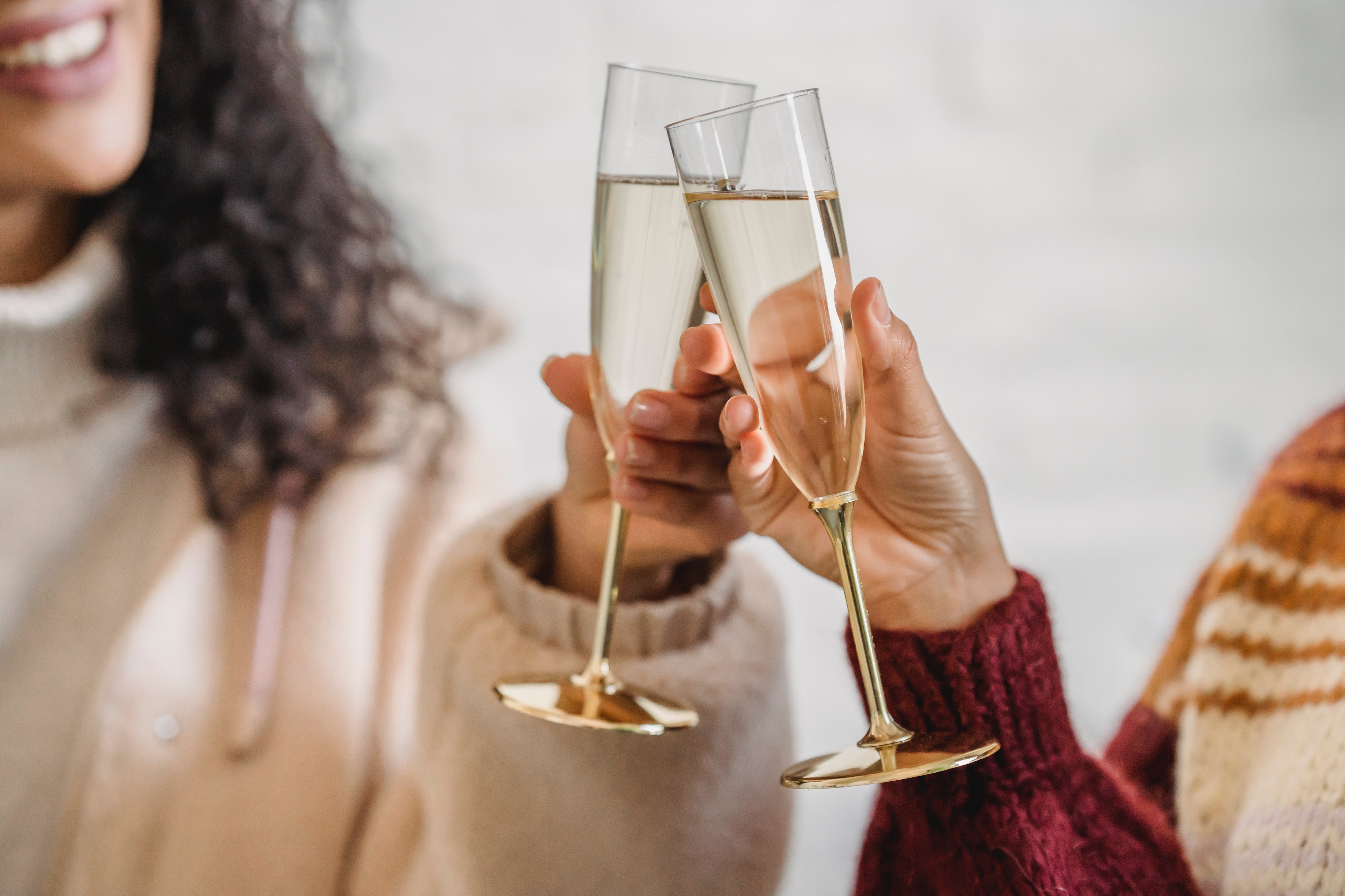 champagne cheers for new year to reflect on 2021